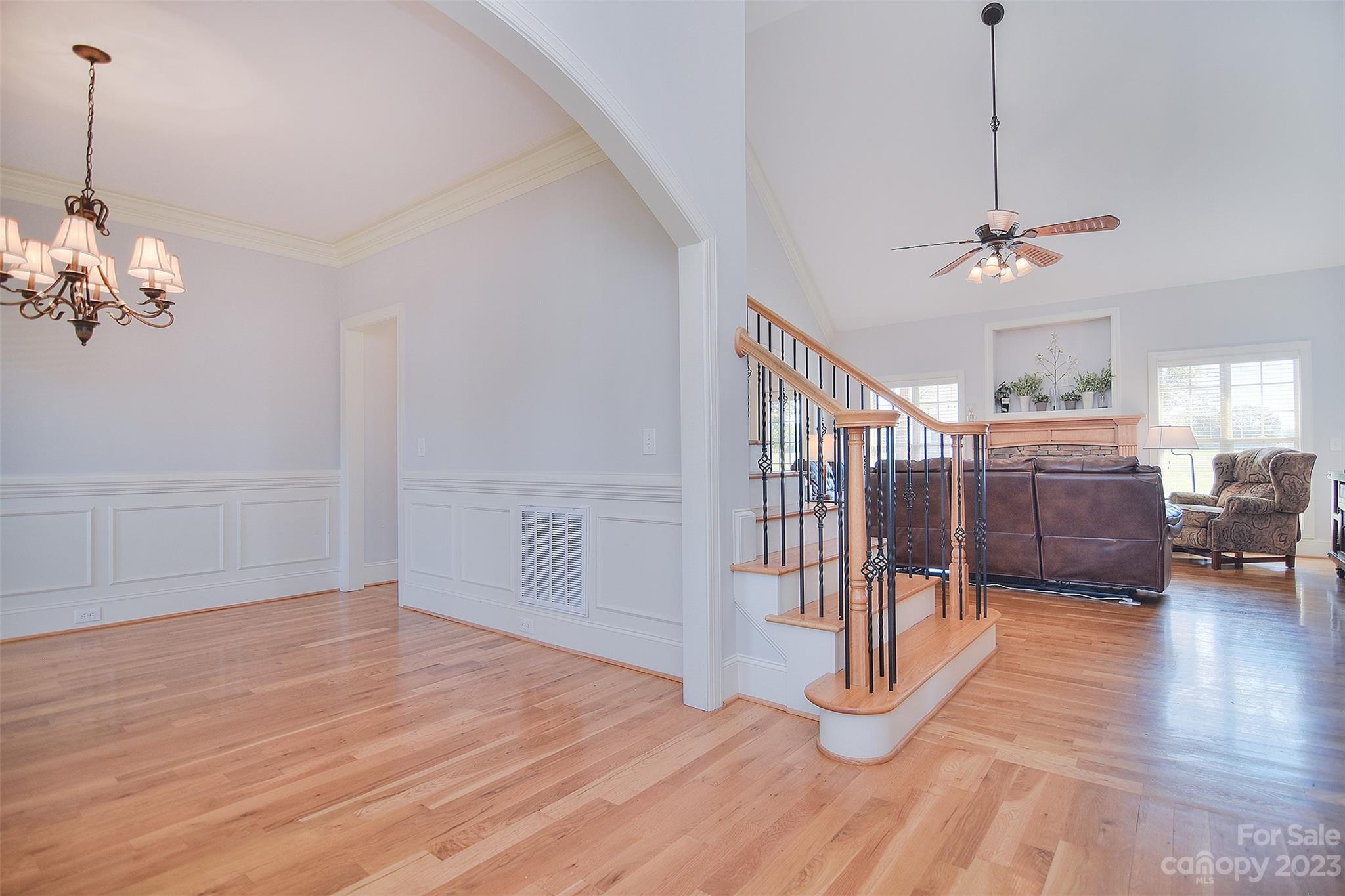 4913 Campobello Drive Monroe, NC 28110 - Photo 7 of 46 a view of a livingroom with hardwood floor and a ceiling fan