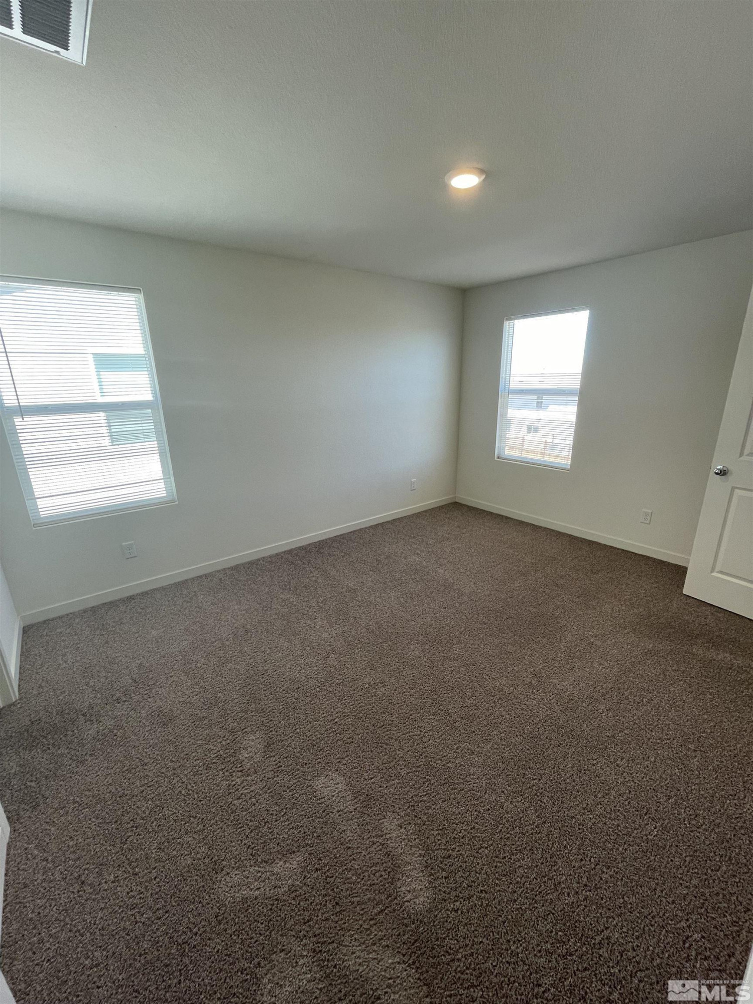 8839 Wolf Moon Drive Reno, NV 89506 - Photo 8 of 15 an empty room with a window
