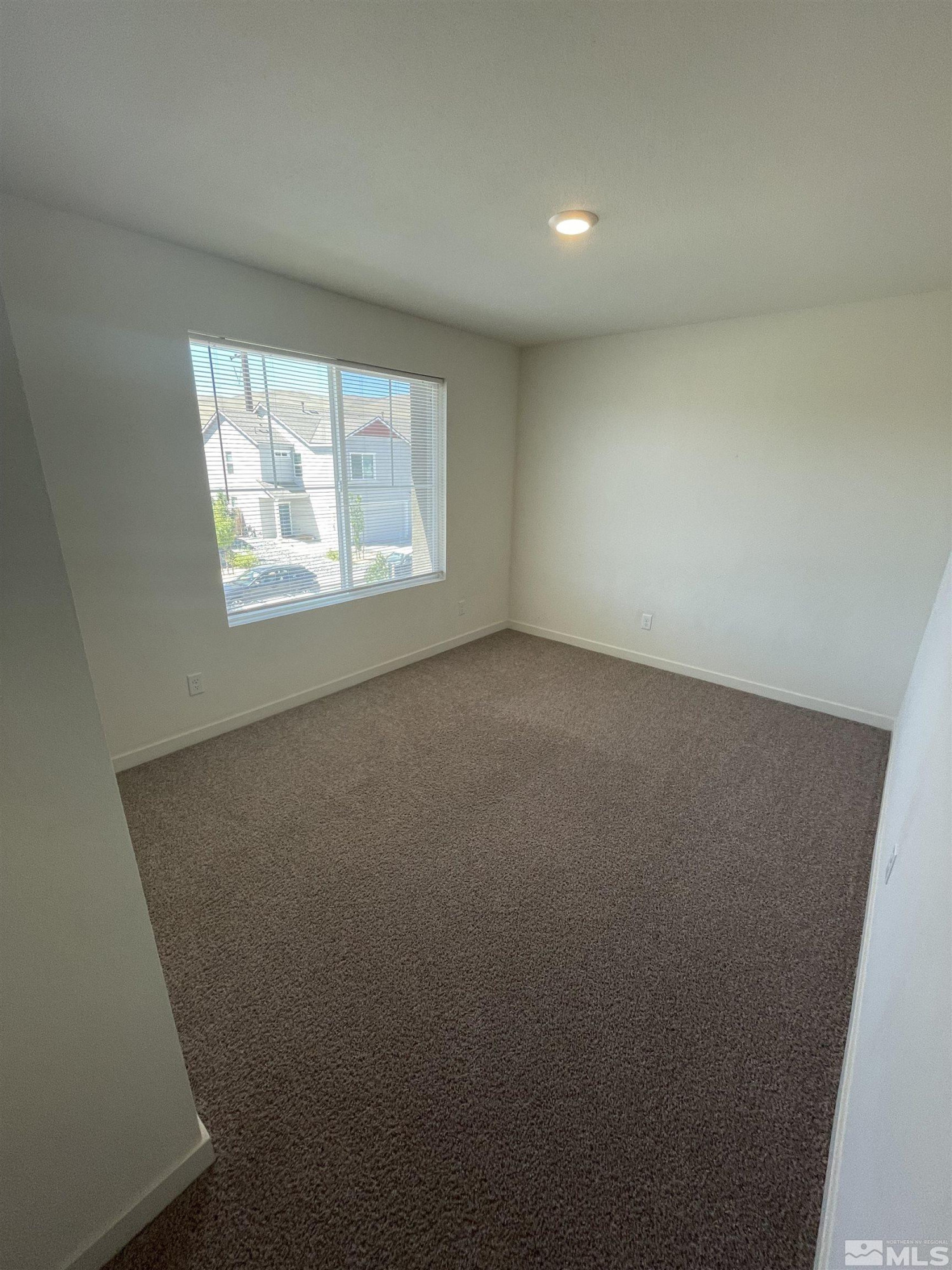 8839 Wolf Moon Drive Reno, NV 89506 - Photo 9 of 15 an empty room with a window