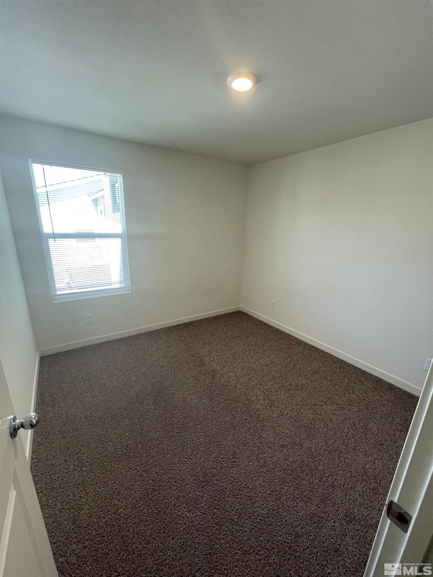 8839 Wolf Moon Drive Reno, NV 89506 - Photo 10 of 15 an empty room with a window