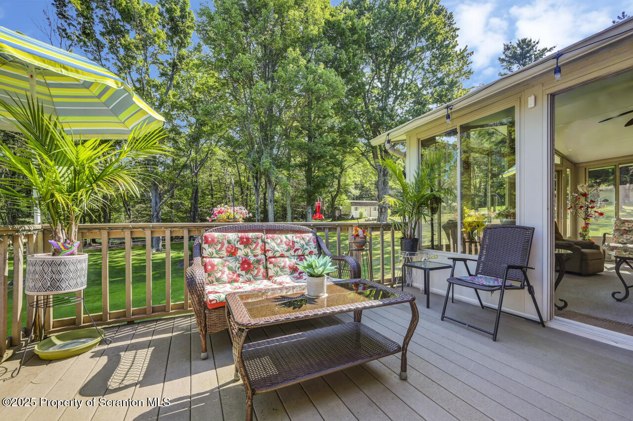 143 Beech Road Moscow, PA 18444 - Photo 35 of 89 a balcony with furniture and a potted plant
