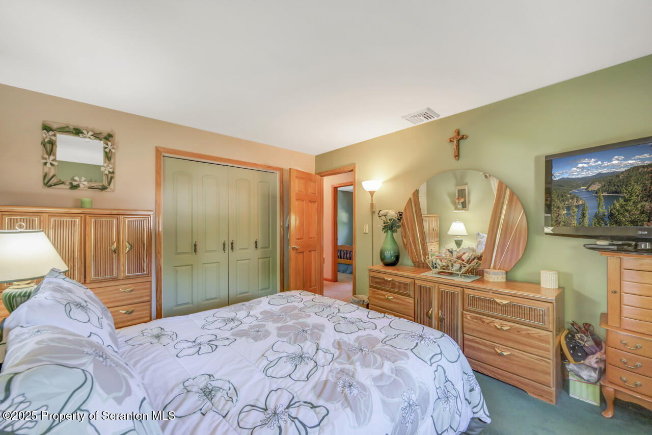 143 Beech Road Moscow, PA 18444 - Photo 40 of 89 a bedroom with a bed and a dresser