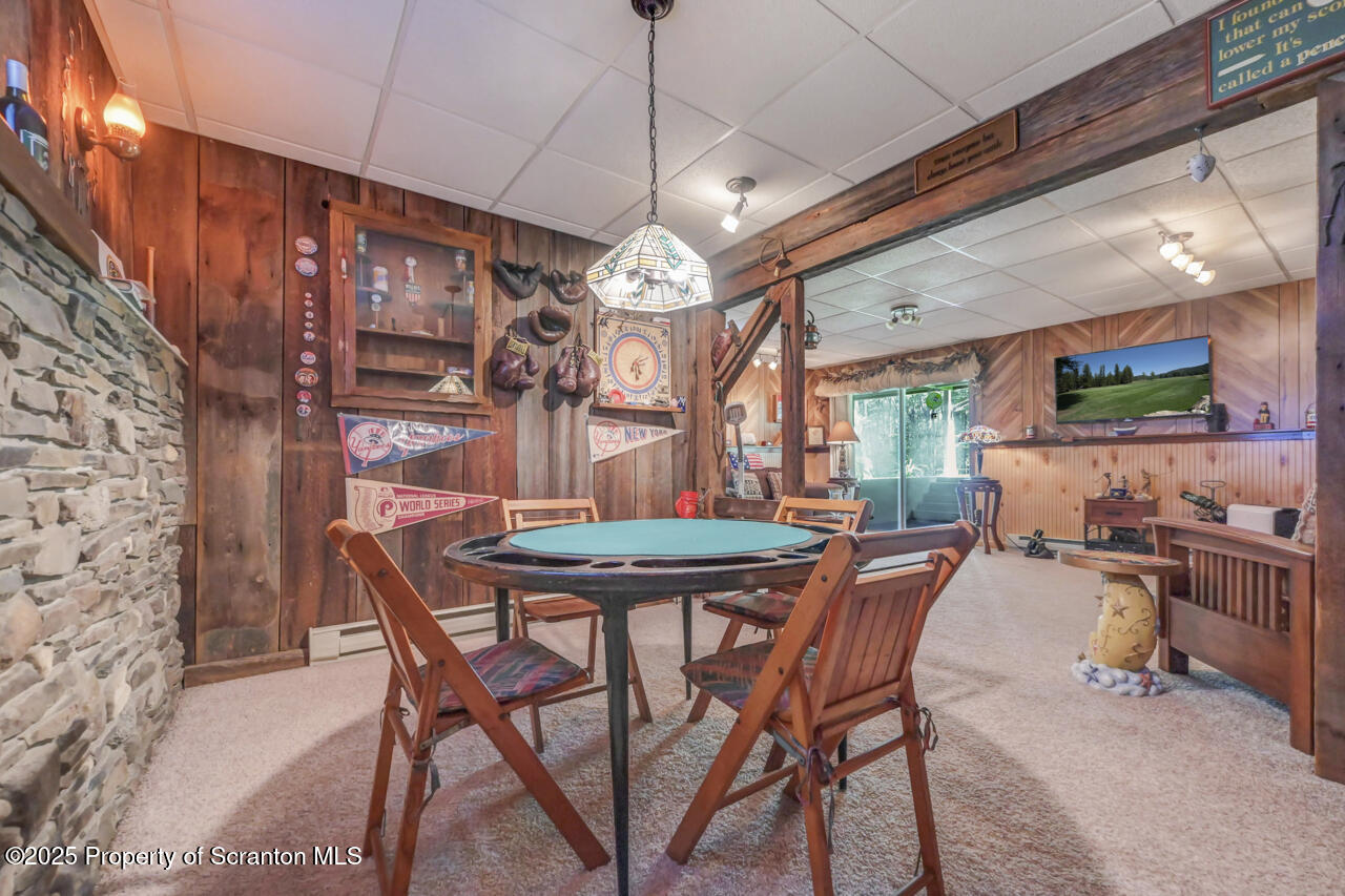 143 Beech Road Moscow, PA 18444 - Photo 51 of 89 a view of a dining room with furniture and a chandelier