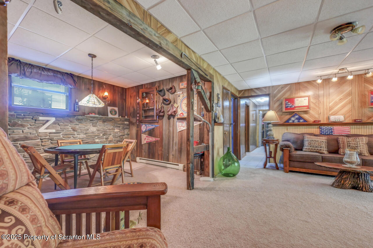 143 Beech Road Moscow, PA 18444 - Photo 58 of 89 a view of a livingroom with furniture and a projector