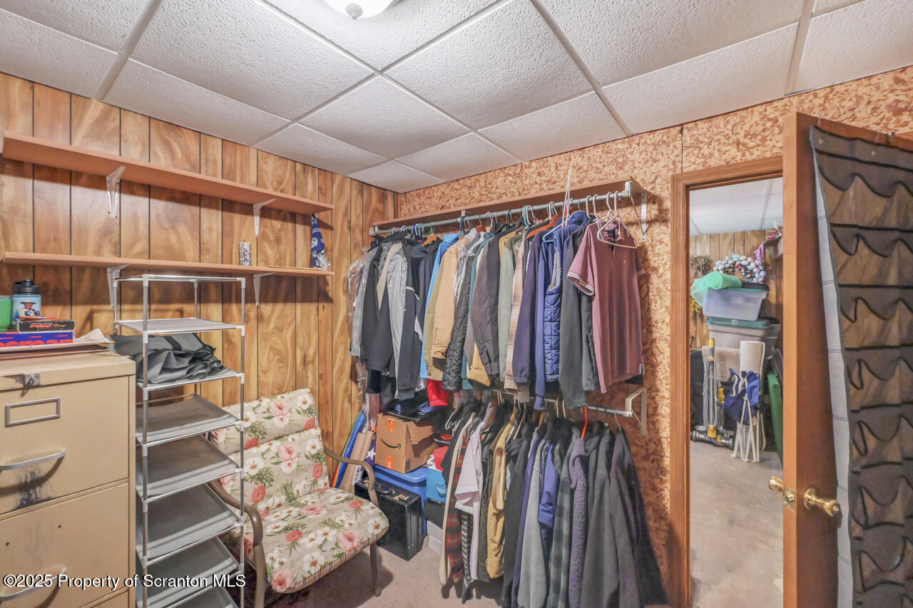 143 Beech Road Moscow, PA 18444 - Photo 64 of 89 a view of walk in closet with clothes and shoes