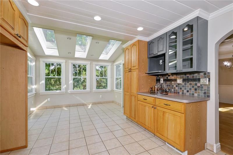 102 Franklin Road South Mars, PA 16046 - Photo 11 of 25 Kitchen eating area with skylights and window wall