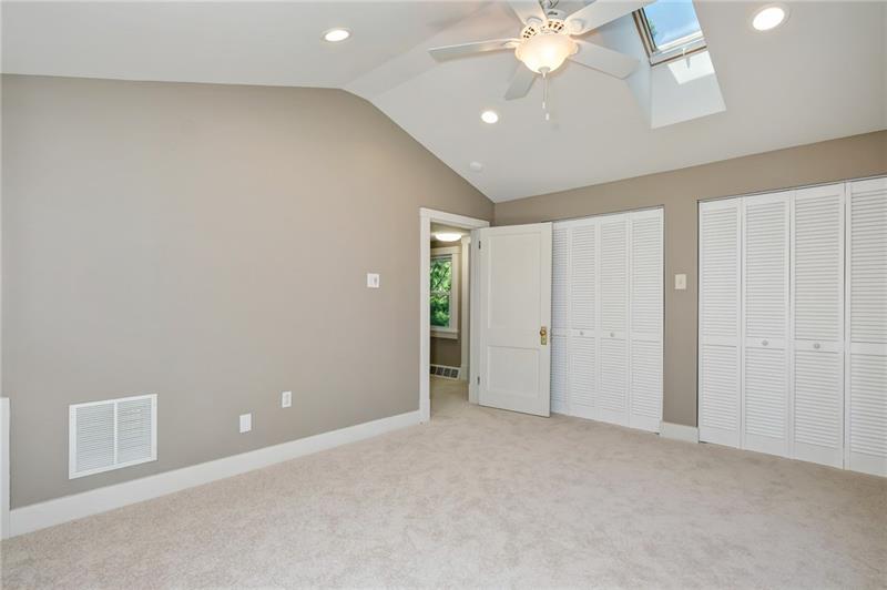102 Franklin Road South Mars, PA 16046 - Photo 22 of 25 Master bedroom showing closets, skylight, ceiling fan and vaulted ceiling