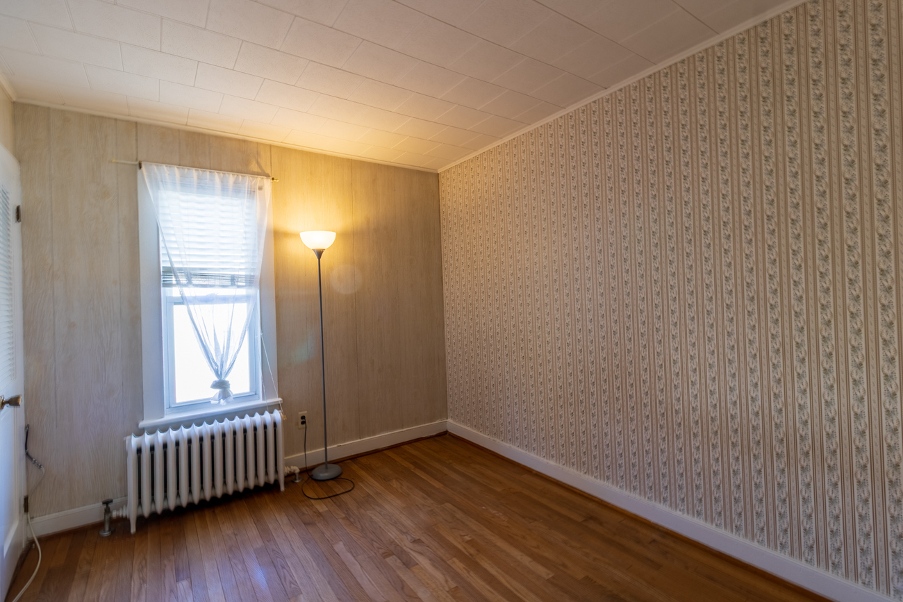 16 Smith Street, Unit 2 Danbury, CT 06810 - Photo 13 of 14 a view of an empty room with wooden floor and a window