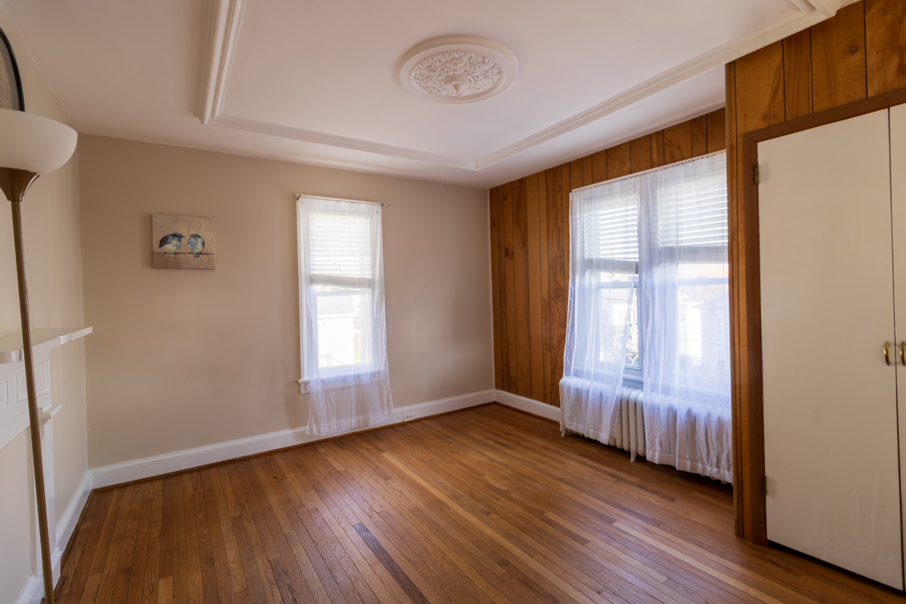 16 Smith Street, Unit 2 Danbury, CT 06810 - Photo 4 of 14 a view of an empty room with wooden floor and a window