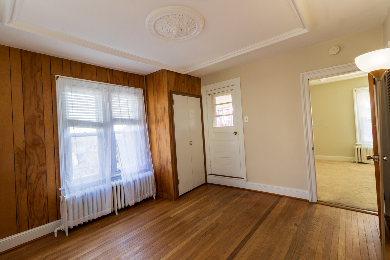 16 Smith Street, Unit 2 Danbury, CT 06810 - Photo 5 of 14 an empty room with wooden floor and windows