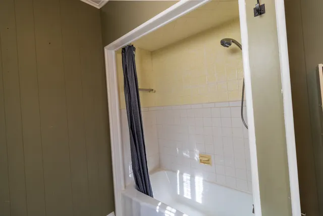 an empty room with a empty space and windows