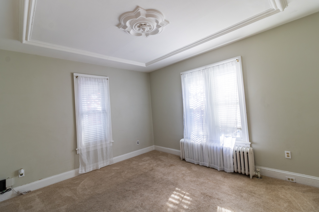 16 Smith Street, Unit 2 Danbury, CT 06810 - Photo 10 of 14 an empty room with a empty space and windows