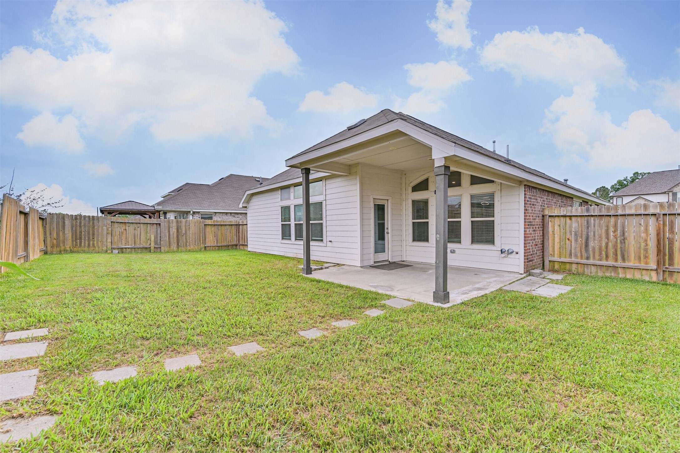 7019 Terra Drive Manvel, TX 77578 - Photo 39 of 41 a view of a house with a yard and deck
