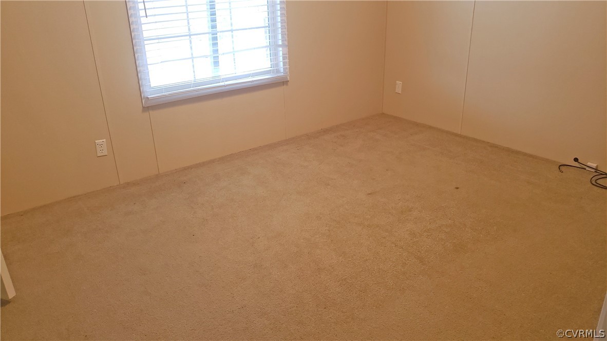 7215 Lunenburg County Road Keysville, VA 23947 - Photo 12 of 16 an empty room with a window