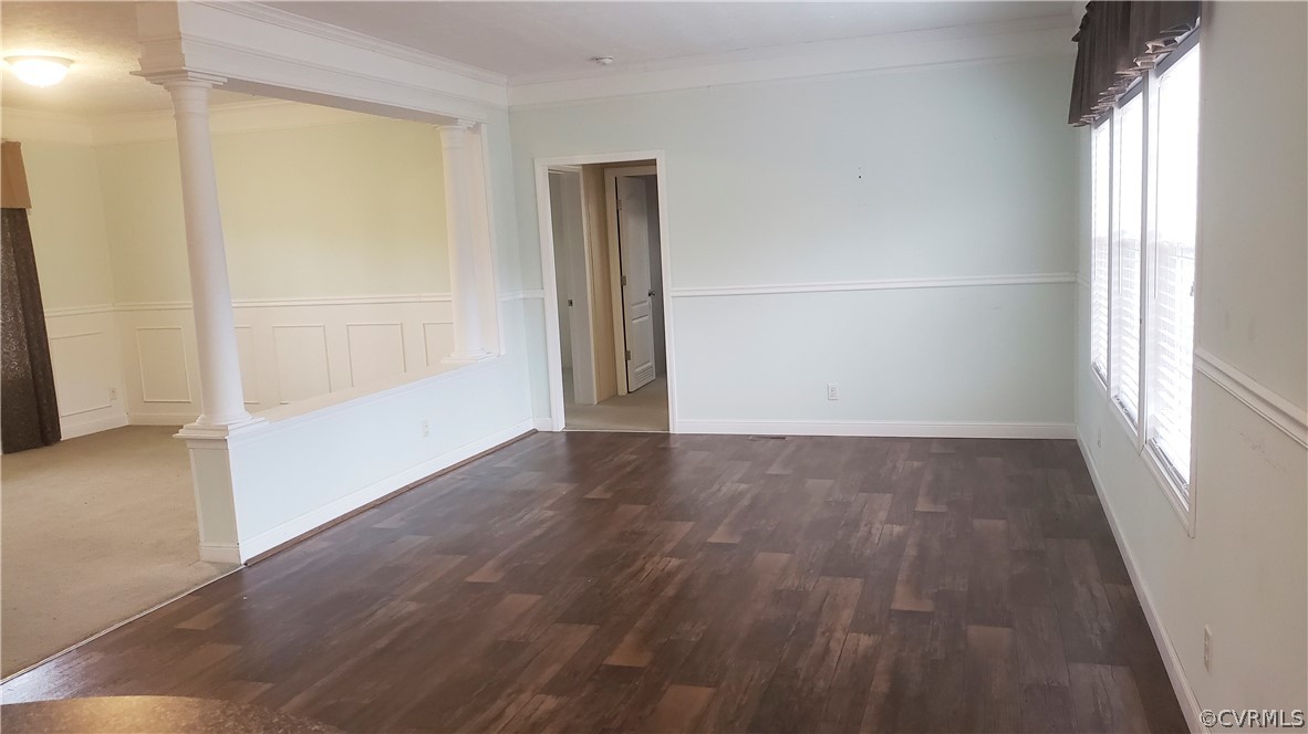 7215 Lunenburg County Road Keysville, VA 23947 - Photo 8 of 16 an empty room with wooden floor and windows