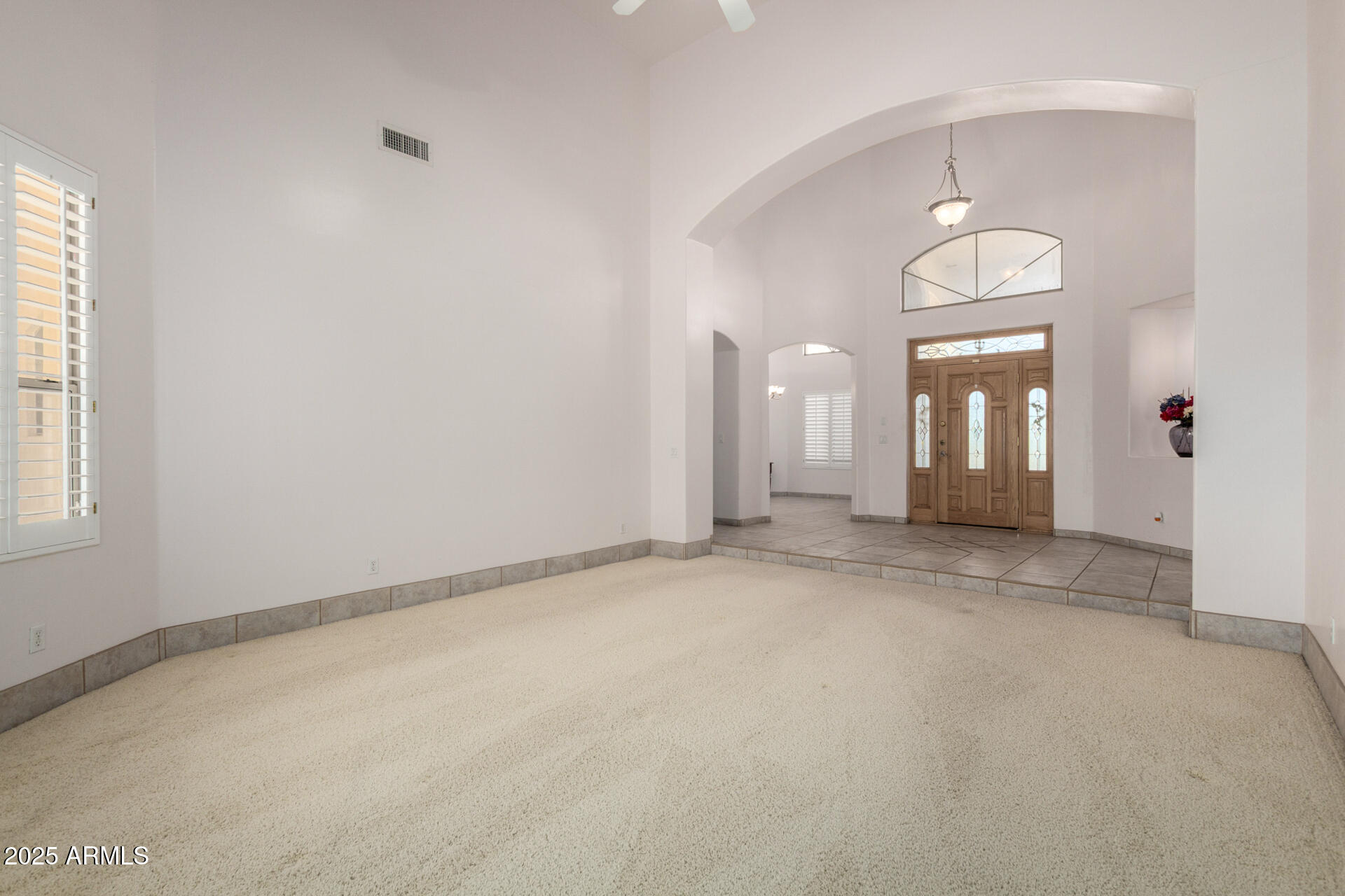 8828 South 16th Street Phoenix, AZ 85042 - Photo 15 of 63 an empty room with a mirror and a window