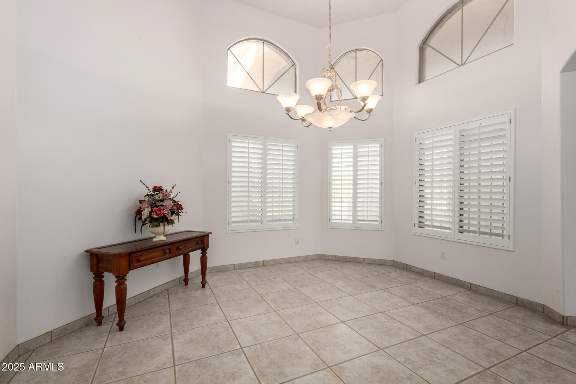 8828 South 16th Street Phoenix, AZ 85042 - Photo 16 of 63 an empty room with wooden floor and windows