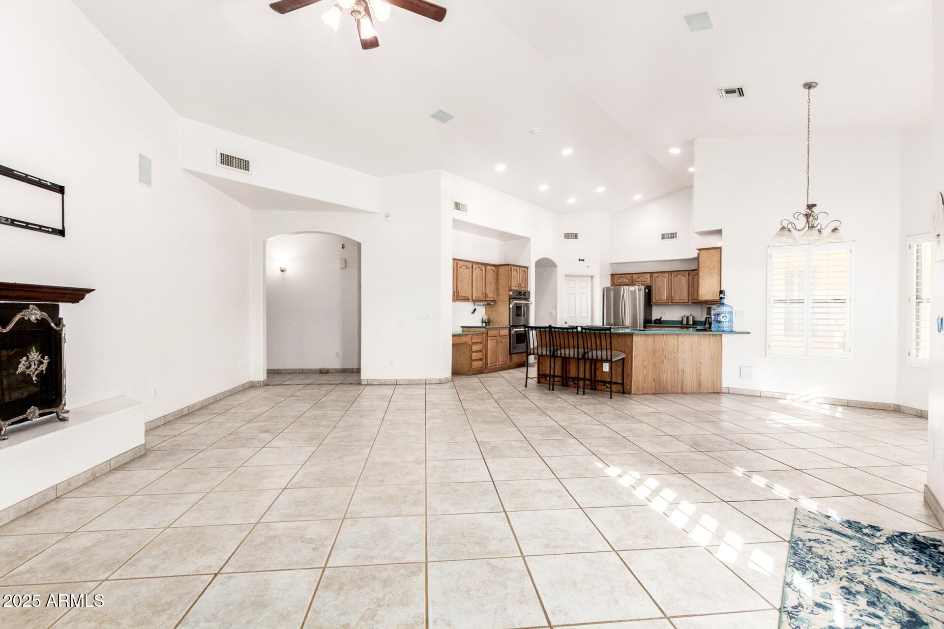8828 South 16th Street Phoenix, AZ 85042 - Photo 22 of 63 a view of a kitchen with furniture and a chandelier