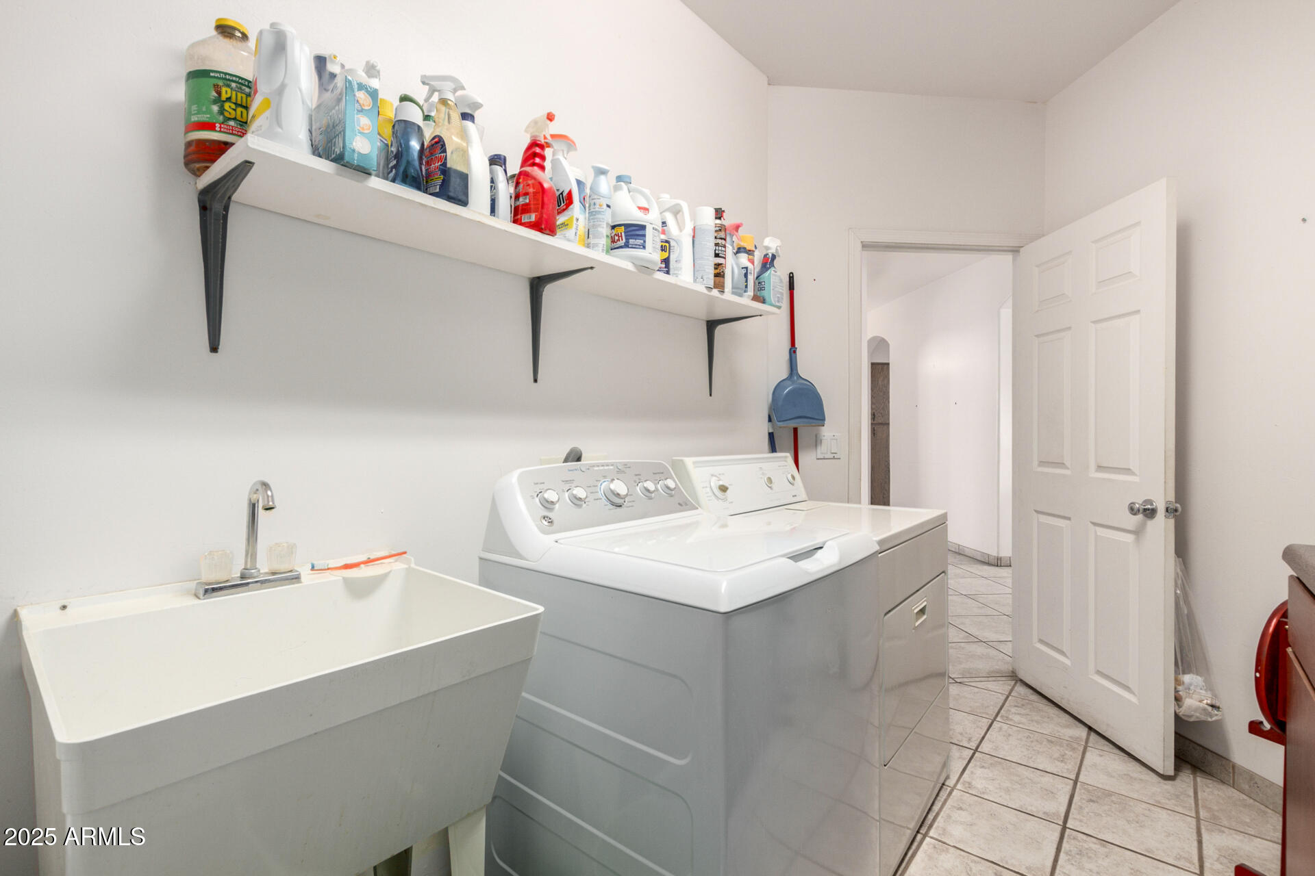 8828 South 16th Street Phoenix, AZ 85042 - Photo 34 of 63 a utility room with a sink dryer and washer