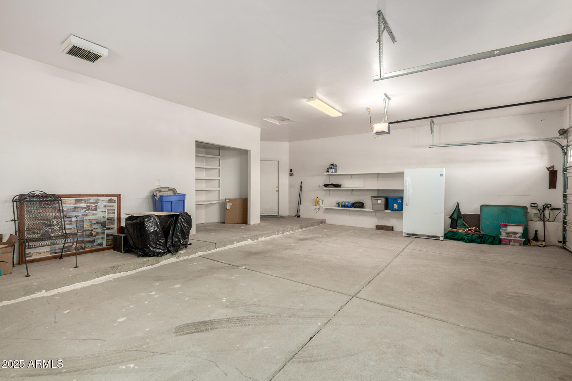 8828 South 16th Street Phoenix, AZ 85042 - Photo 36 of 63 a view of a livingroom with furniture and a garage
