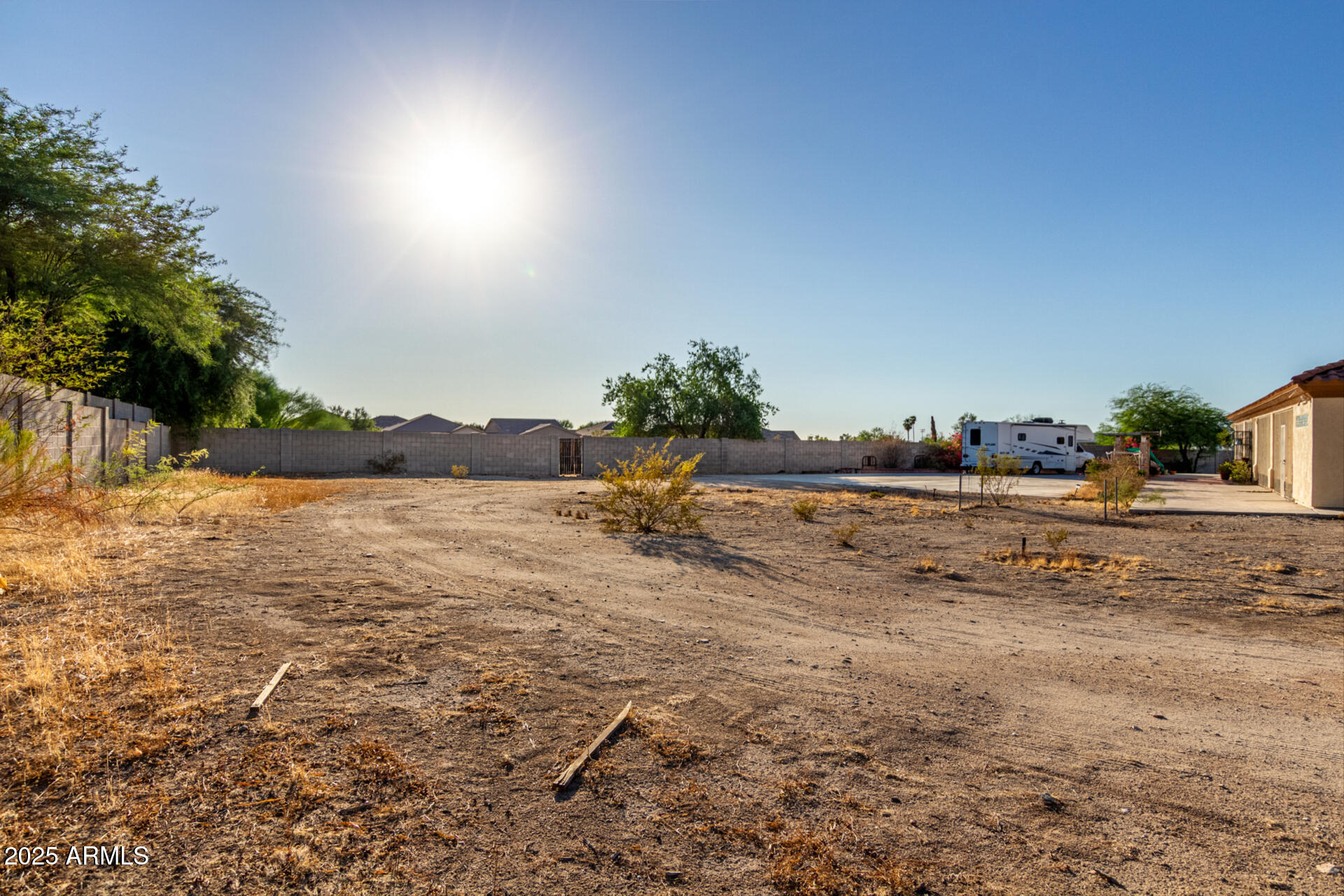 8828 South 16th Street Phoenix, AZ 85042 - Photo 10 of 63 a view of a lake with beach and house in the background