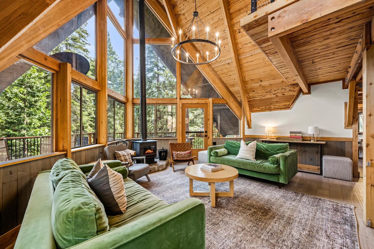 573 Granite Road Carnelian Bay, CA 96140 - Photo 4 of 21 a living room with furniture and a large window