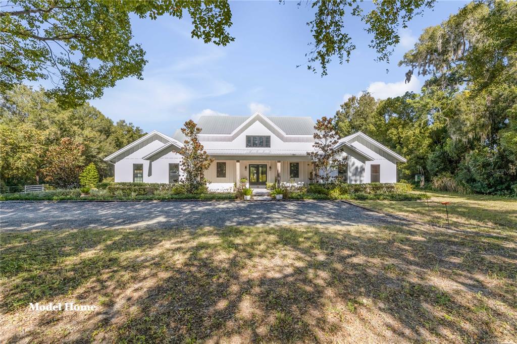 1624 Greens Dairy Road DeLand, FL 32720 - Photo 36 of 51 a front view of a house with a yard