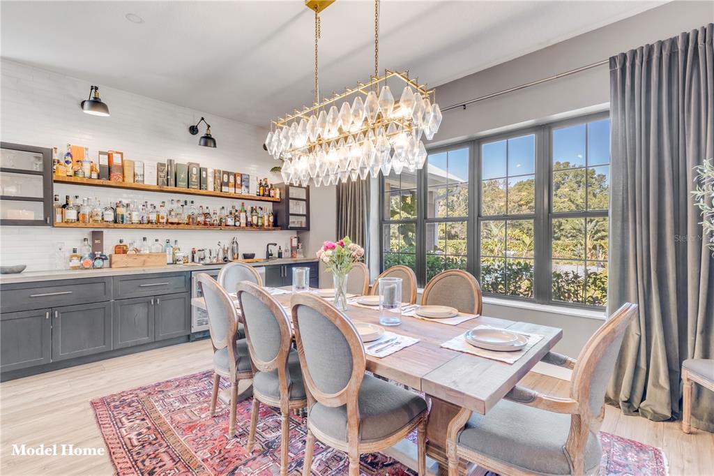 1624 Greens Dairy Road DeLand, FL 32720 - Photo 46 of 51 a view of a dining room with furniture a chandelier and wooden floor