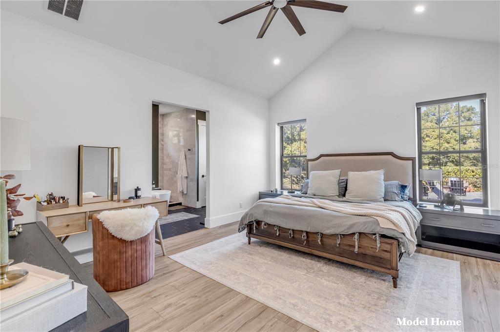 1624 Greens Dairy Road DeLand, FL 32720 - Photo 47 of 51 a bedroom with a bed and wooden floor