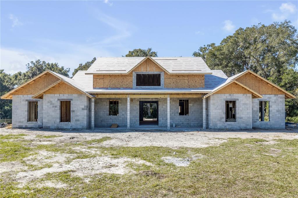 1624 Greens Dairy Road DeLand, FL 32720 - Photo 10 of 51 a front view of a house with a yard