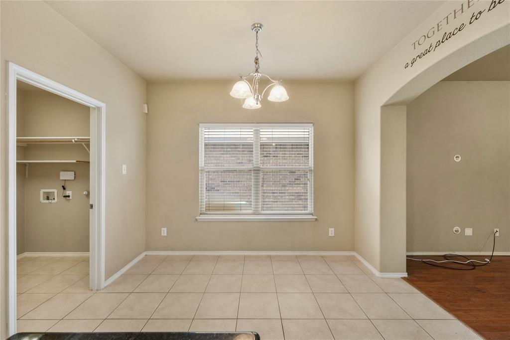 2003 Diamondback Forney, TX 75126 - Photo 12 of 30 Spare room featuring light hardwood / wood-style flooring and a chandelier