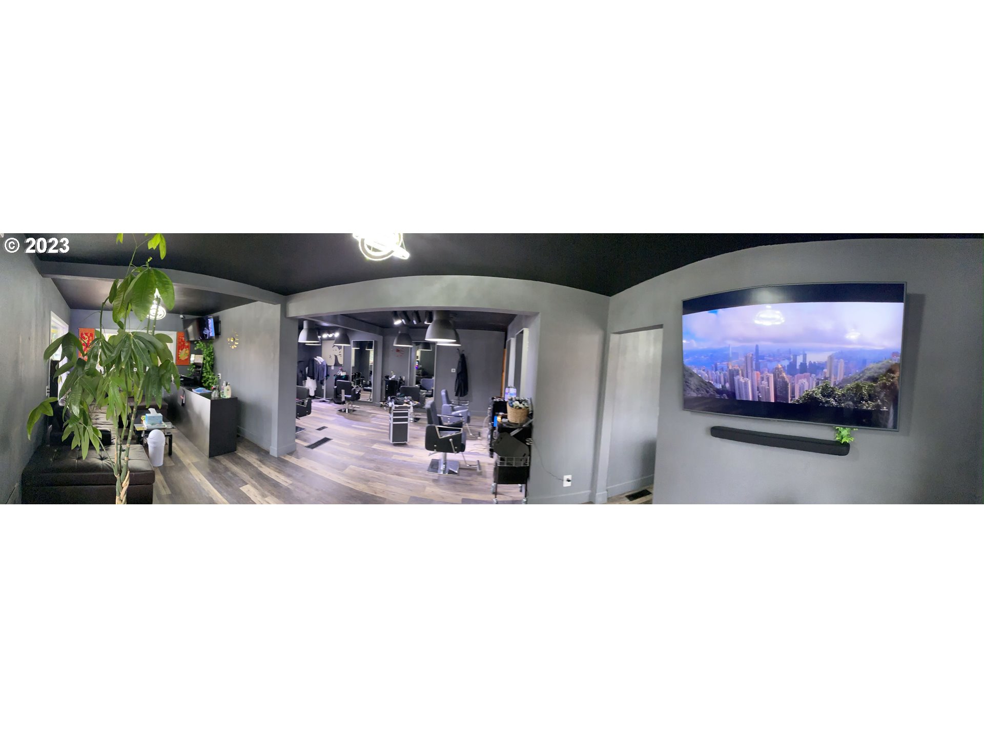 509 East 13th Avenue Eugene, OR 97401 - Photo 4 of 21 a view of a living room with floor to ceiling windows and a flat screen