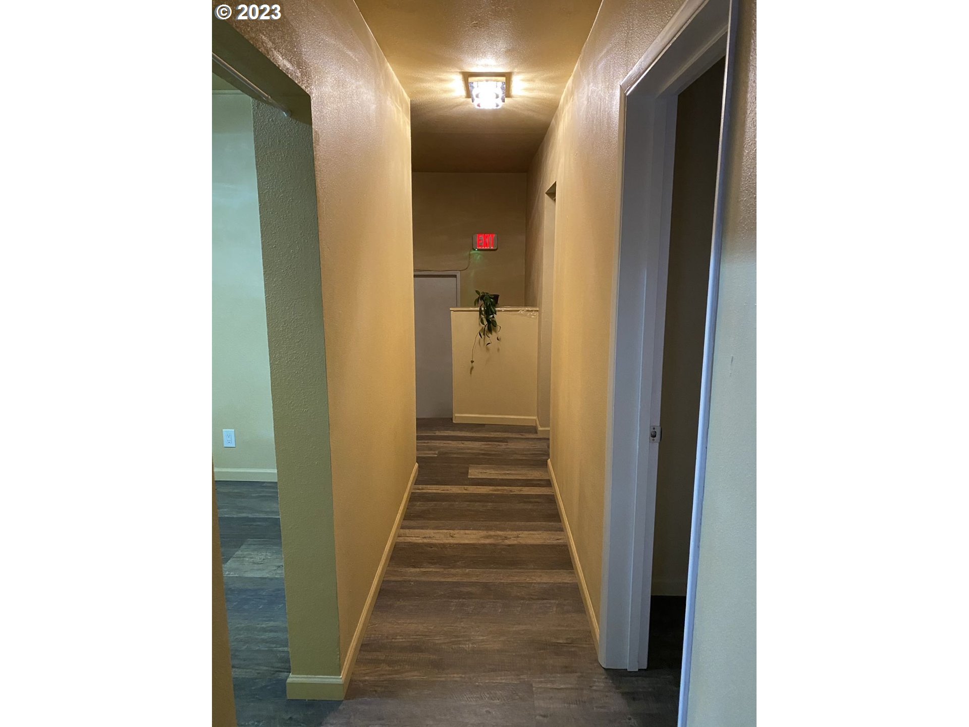 509 East 13th Avenue Eugene, OR 97401 - Photo 10 of 21 a view of a hallway with wooden floor