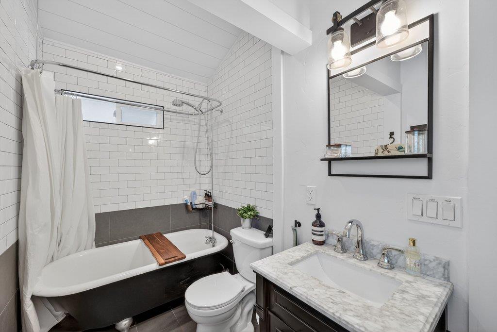 125 Shadowbrook Road Ben Lomond, CA 95005 - Photo 34 of 60 a bathroom with a granite countertop toilet sink and mirror