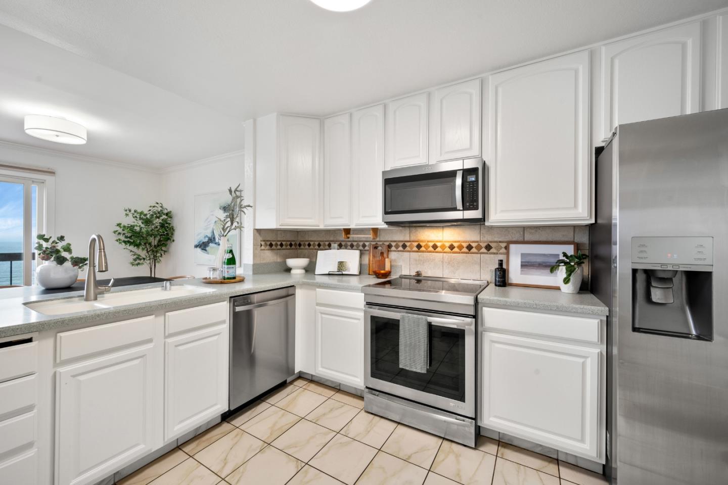 445 Roberts Road Pacifica, CA 94044 - Photo 14 of 40 a kitchen with cabinets stainless steel appliances and a counter space