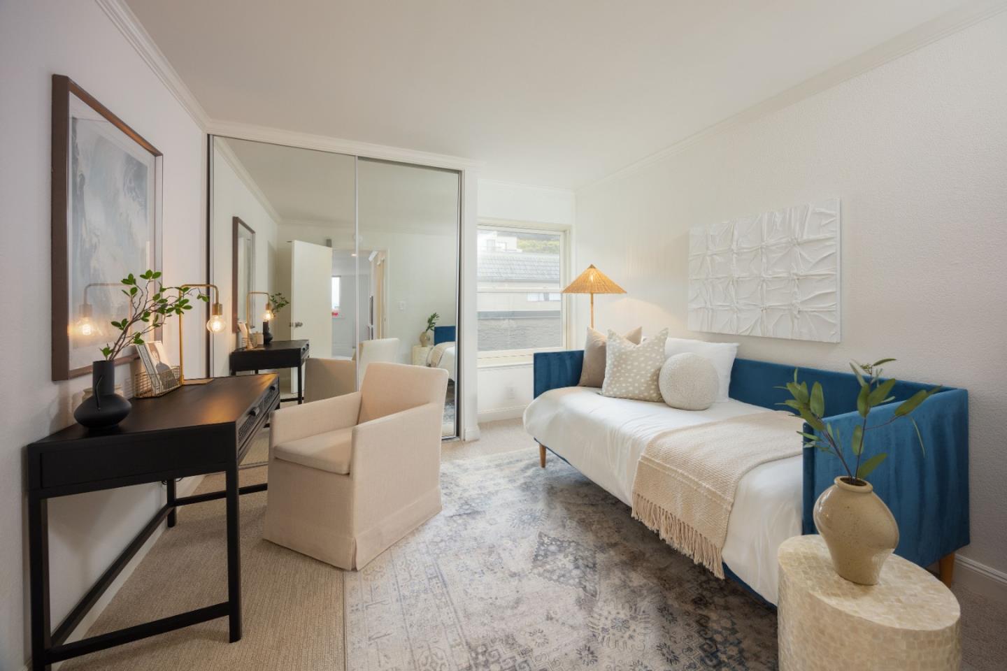 445 Roberts Road Pacifica, CA 94044 - Photo 21 of 40 a bedroom with bed and a large mirror