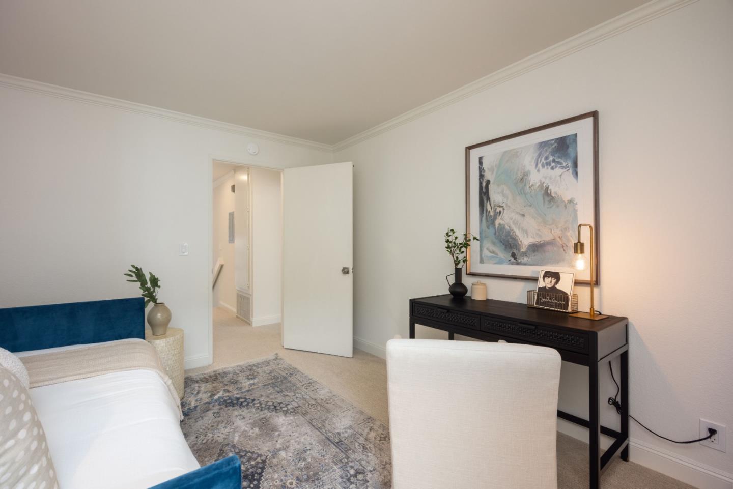 445 Roberts Road Pacifica, CA 94044 - Photo 22 of 40 a bedroom with a bed and a mirror