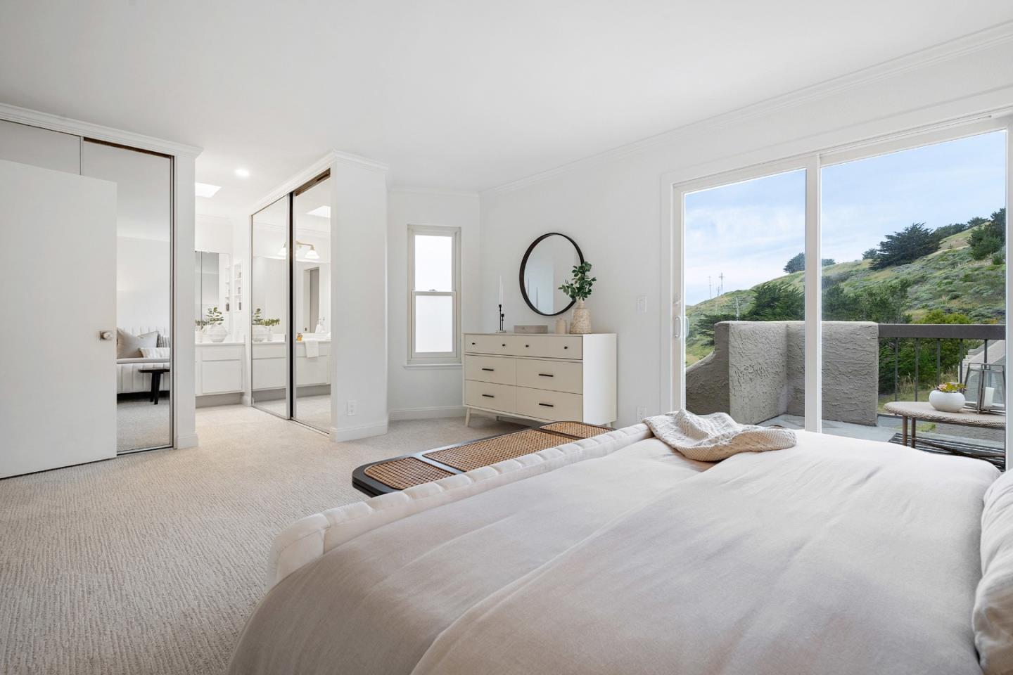 445 Roberts Road Pacifica, CA 94044 - Photo 28 of 40 a bedroom with a bed and a large window