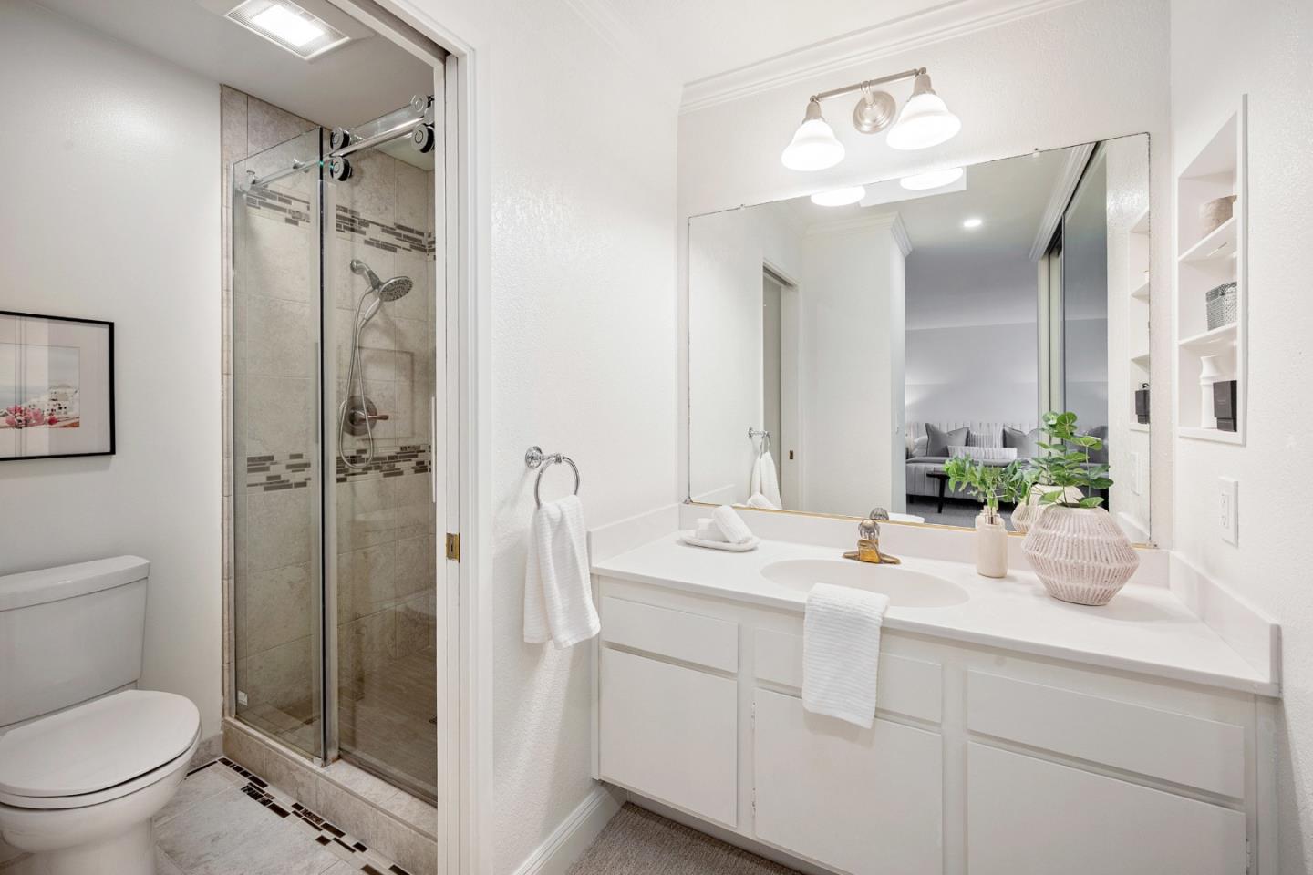 445 Roberts Road Pacifica, CA 94044 - Photo 29 of 40 a bathroom with a sink a toilet and shower