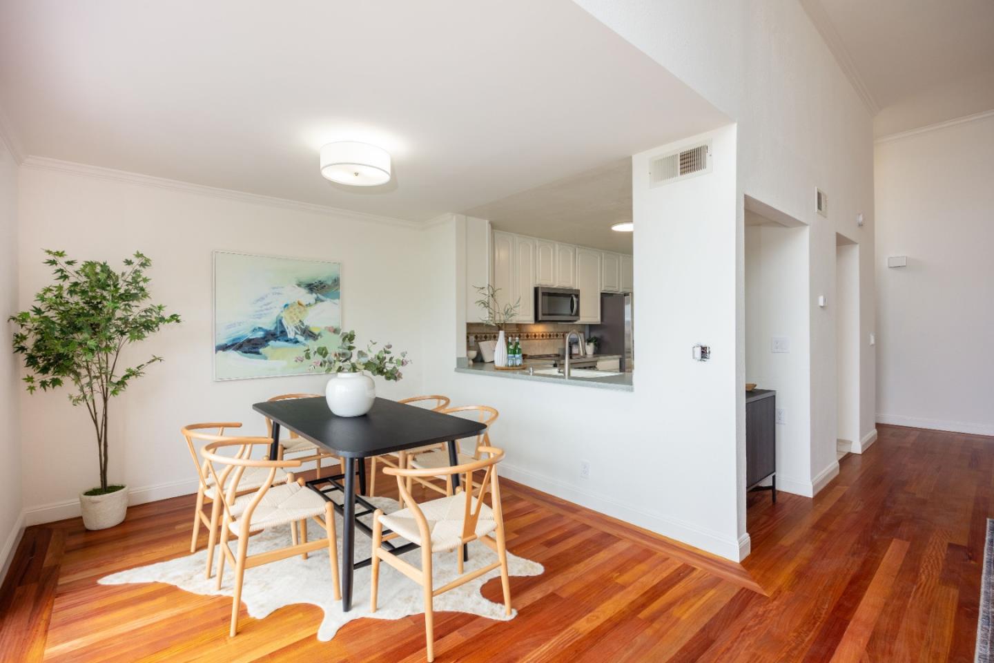 445 Roberts Road Pacifica, CA 94044 - Photo 10 of 40 a view of a dining room with furniture and wooden floor