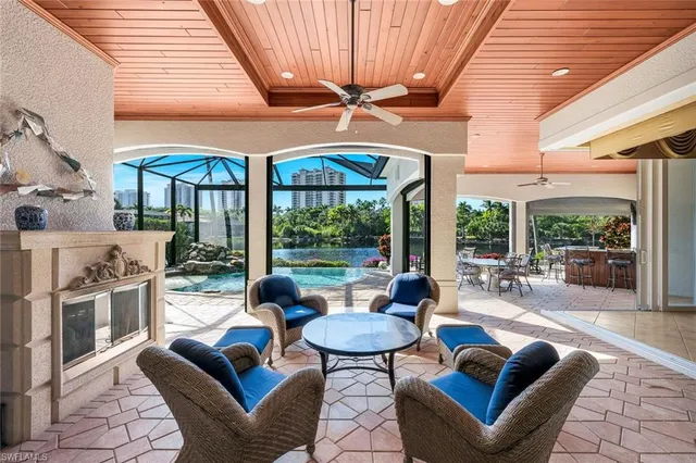 a outdoor space with patio the couches and pool table with chairs