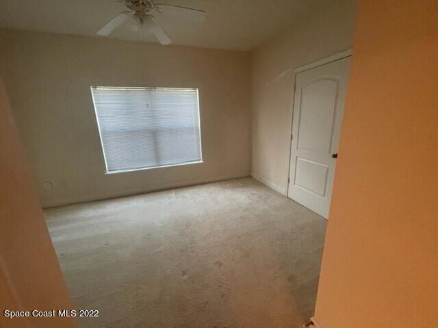 6460 Borasco Drive, Unit 1902 Melbourne, FL 32940 - Photo 11 of 36 an empty room with a window