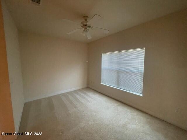 6460 Borasco Drive, Unit 1902 Melbourne, FL 32940 - Photo 13 of 36 an empty room with a window