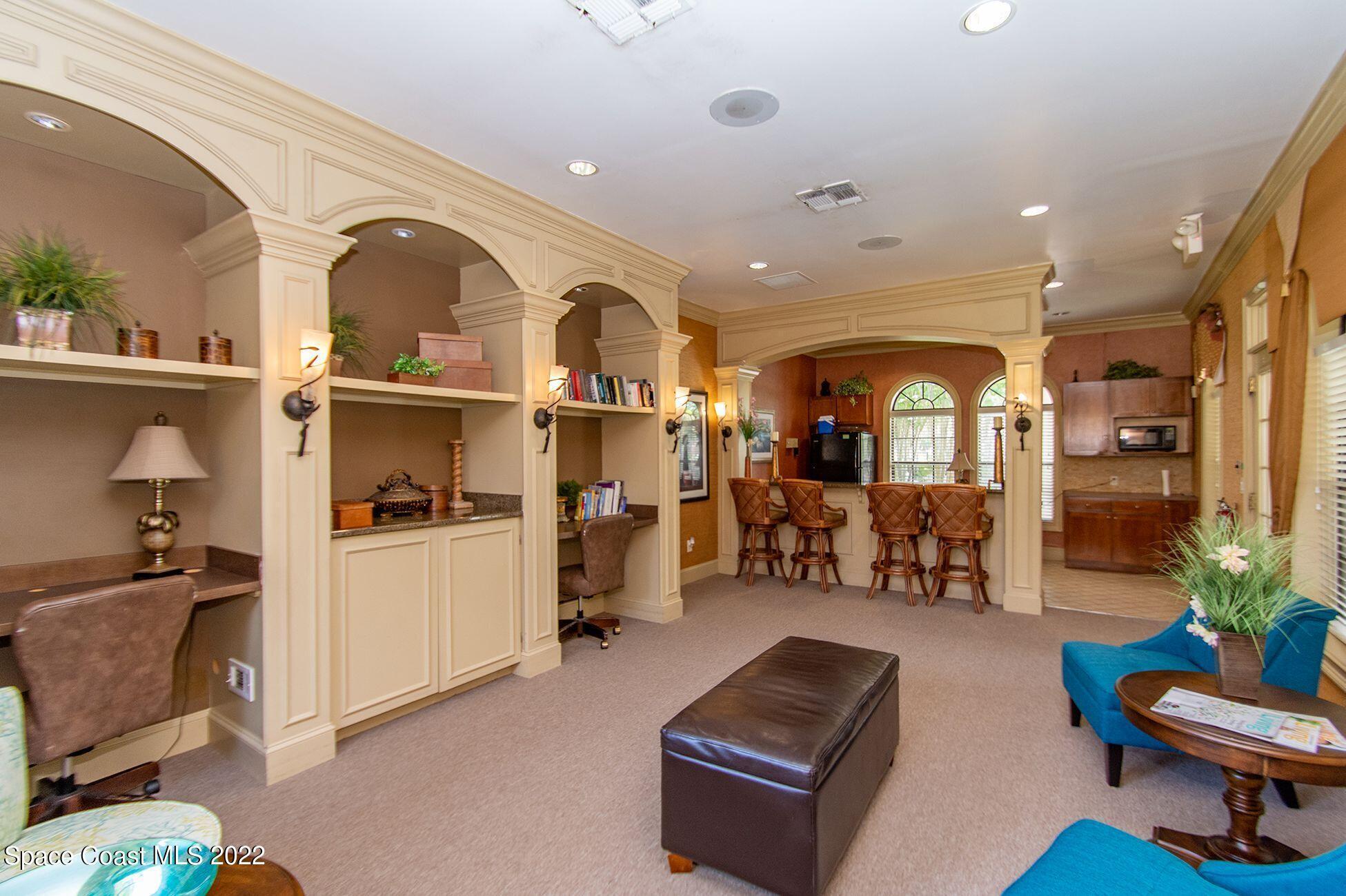 6460 Borasco Drive, Unit 1902 Melbourne, FL 32940 - Photo 15 of 36 a living room with furniture gym equipment and view of living room