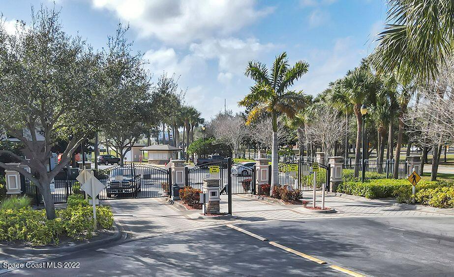6460 Borasco Drive, Unit 1902 Melbourne, FL 32940 - Photo 20 of 36 a view of outdoor space with trees