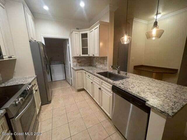 6460 Borasco Drive, Unit 1902 Melbourne, FL 32940 - Photo 2 of 36 a large kitchen with granite countertop a sink stove and refrigerator
