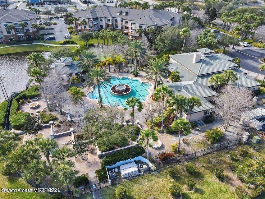 6460 Borasco Drive, Unit 1902 Melbourne, FL 32940 - Photo 30 of 36 an aerial view of a house with a yard