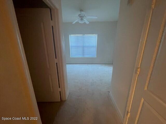 6460 Borasco Drive, Unit 1902 Melbourne, FL 32940 - Photo 9 of 36 a view of hallway with a window