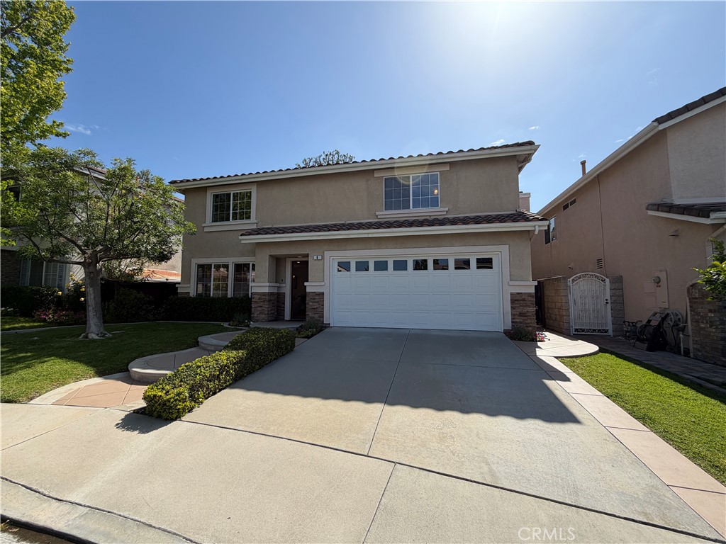 6 Hemingway Court Rancho Santa Margarita, CA 92679 - Photo 1 of 17 a view of a house with a yard