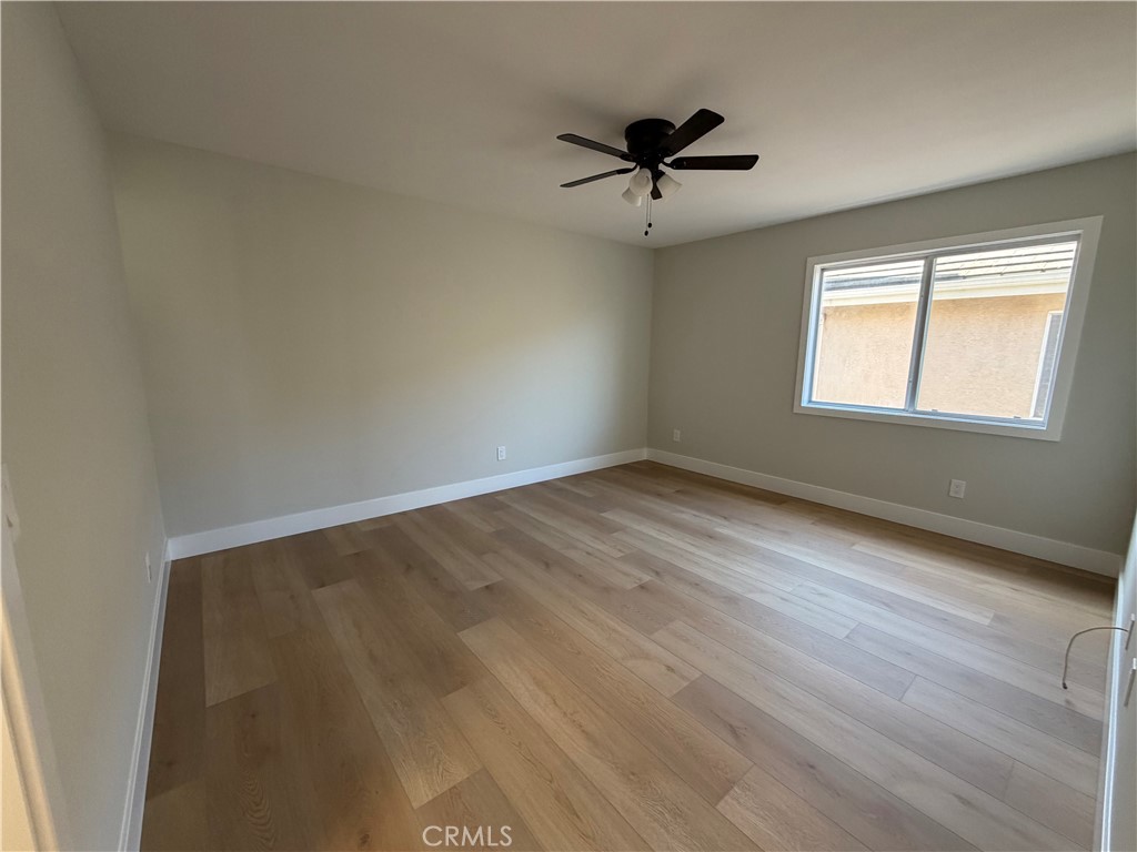 6 Hemingway Court Rancho Santa Margarita, CA 92679 - Photo 15 of 17 wooden floor in an empty room with a window
